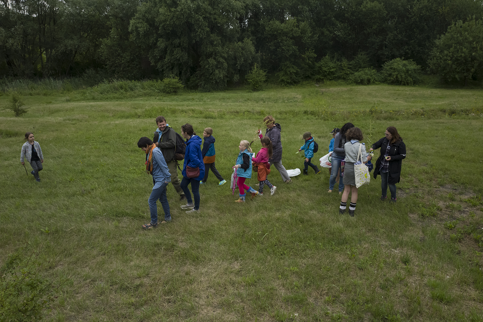 Local children gathering plants for the Medicinal Plant of Płaszów garden.